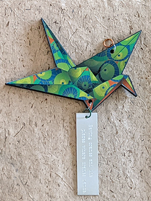 Inscribed origami crane
