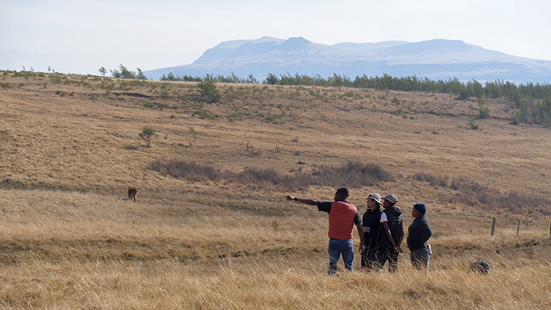 Program staff working with local landowners in the Drakensberg region. Ufulu Studios